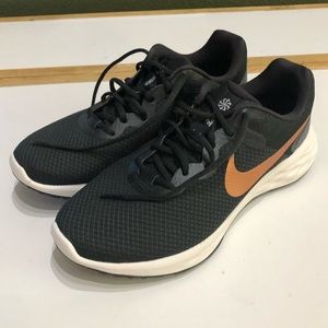 Nike revolution 6 black with gold logo
